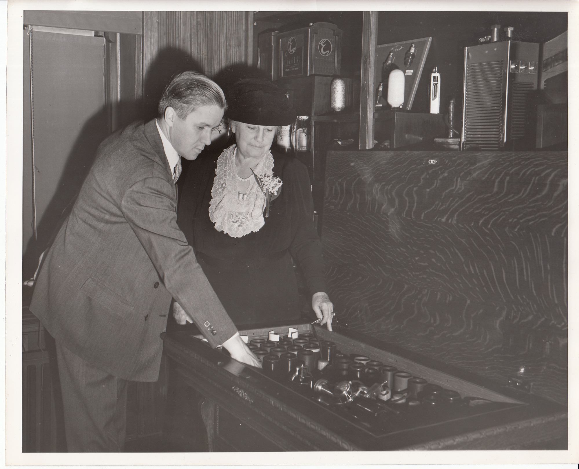 Norman Speiden and Mina Edison examining cylinder records.