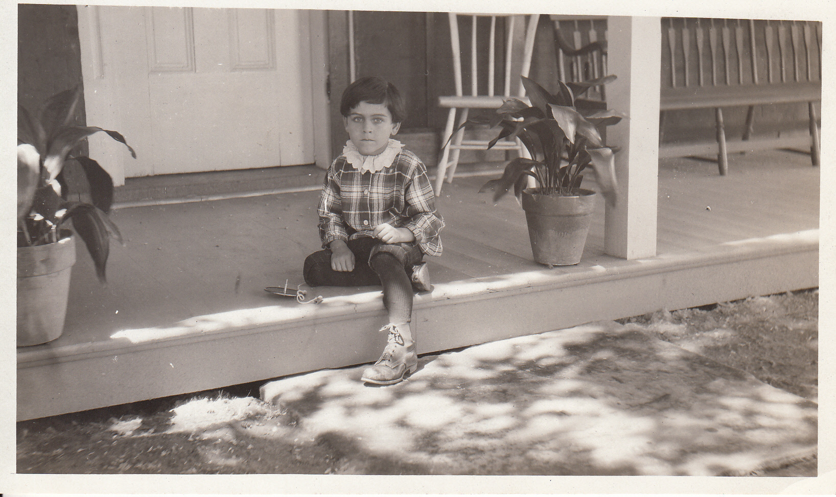 Unidentified child on porch of Thomas Edison's birthplace in Milan, Ohio.