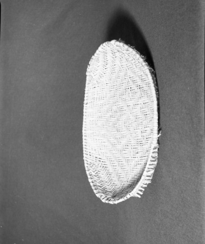 Marie Rozier Collection, Catalog No. 236. Object: Hopi plaited winnower. Dimensions: 16 1/2 x 11 x 2". Materials: yucca. Technology: entirely plaited. Collection History: Bought in Springdale, Utah. c. 1973. Photographed by Michael Dixon, December 1982. Catalogued by Craig Bates and Barbara Beroza. Yosemite Collections, National Park Service. Marie Rozier Collection.