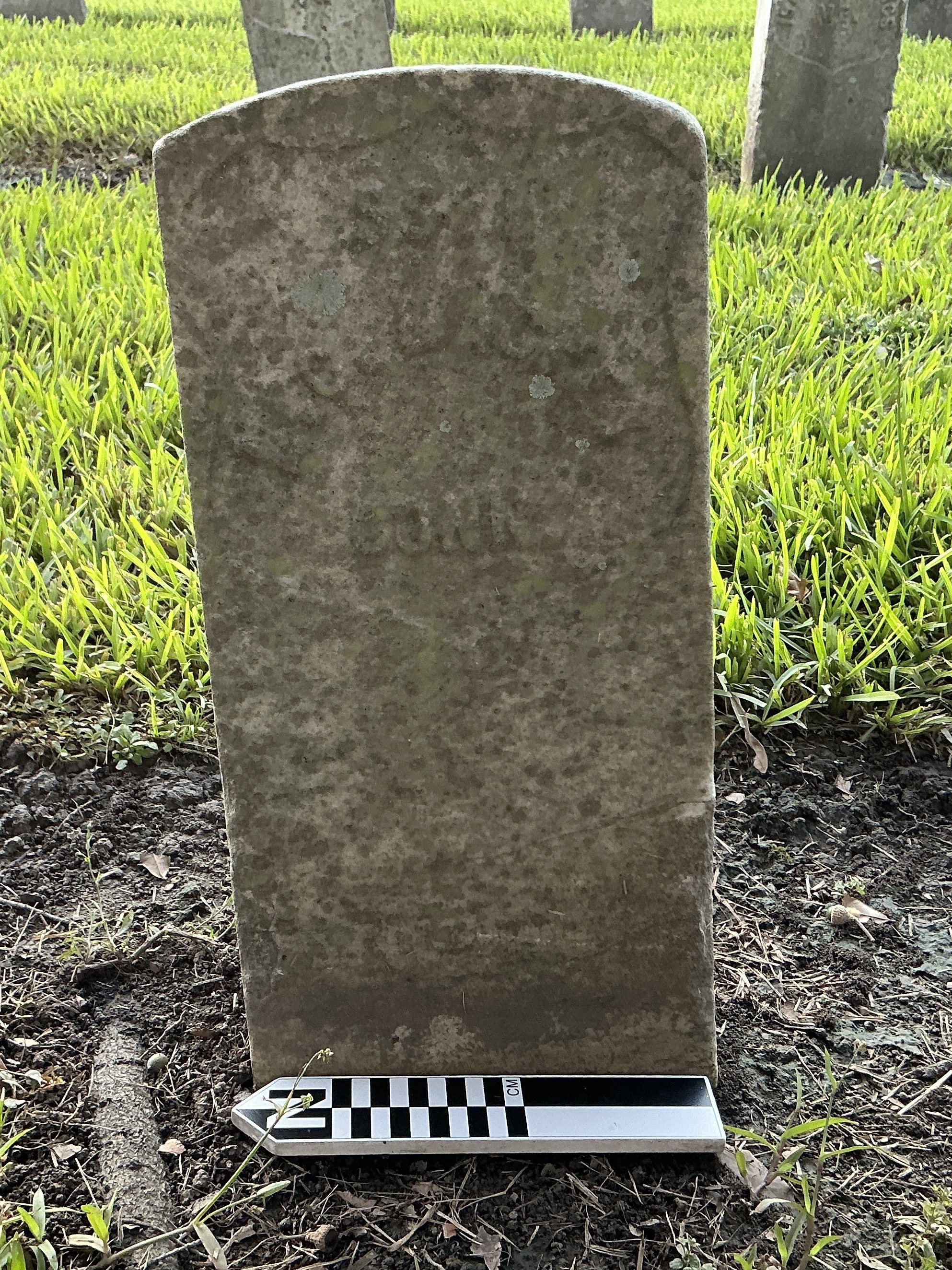 Extra image of historic upright marble headstone with recessed shield face.