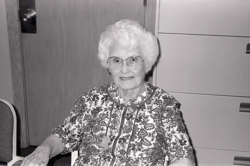 BW Photos of Superintendent Harold Grafe giving award to lady.
