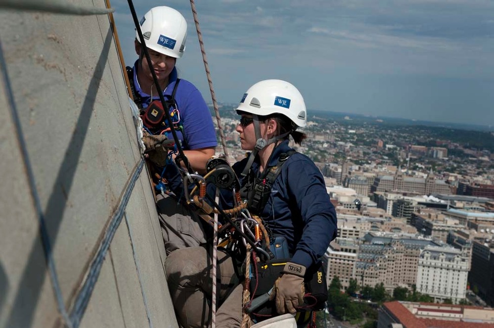 Katie Francis and Emma Cardini work on a section of the Monument.