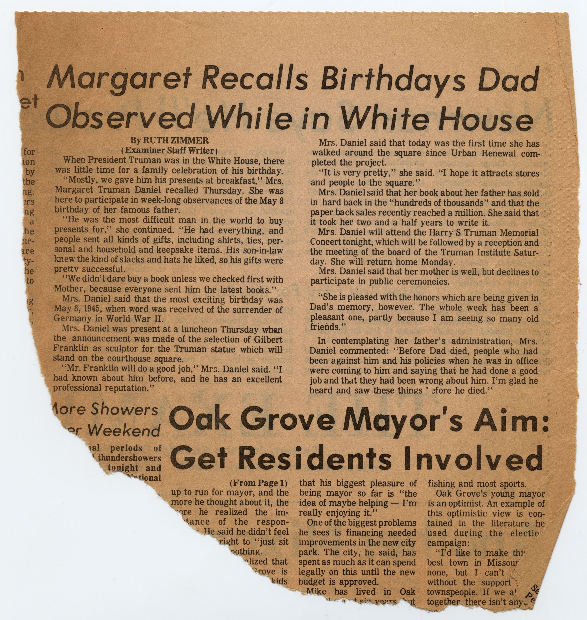 A newspaper clipping with a torn bottom edge.