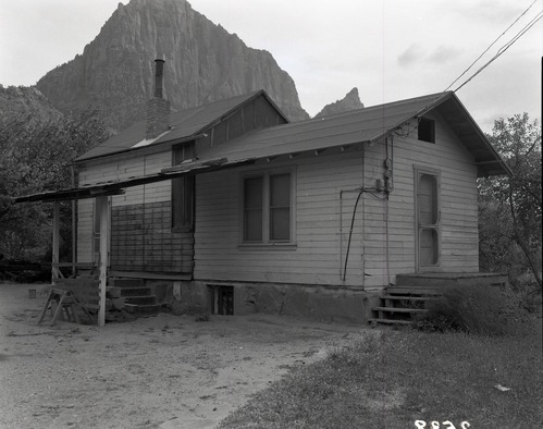 B&W negative showing Rhoda Crawford property east of Virgin River, south of park entrance, with house; appraisal of property pending government purchase, section 28, T 41 S, R 10 W. [Pits, scratches]