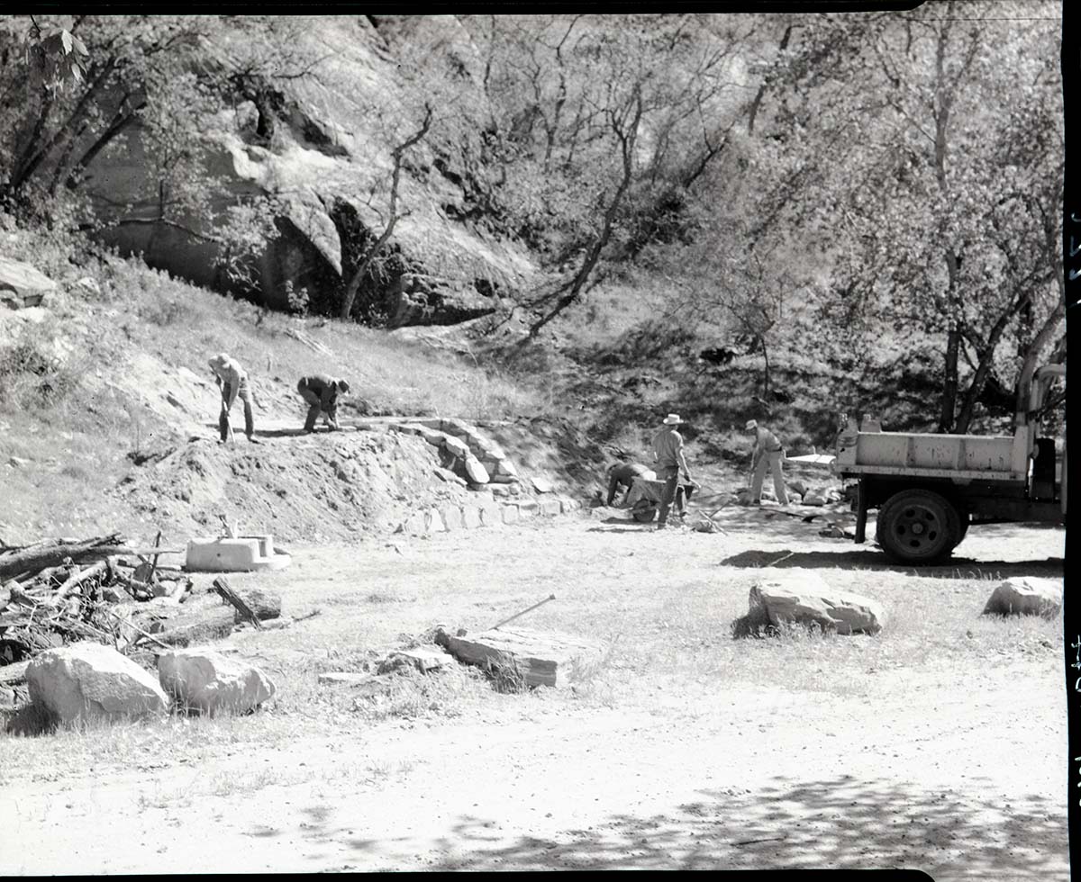 Construction of barbecue pit, NPS workers and truck at Grotto Campground.