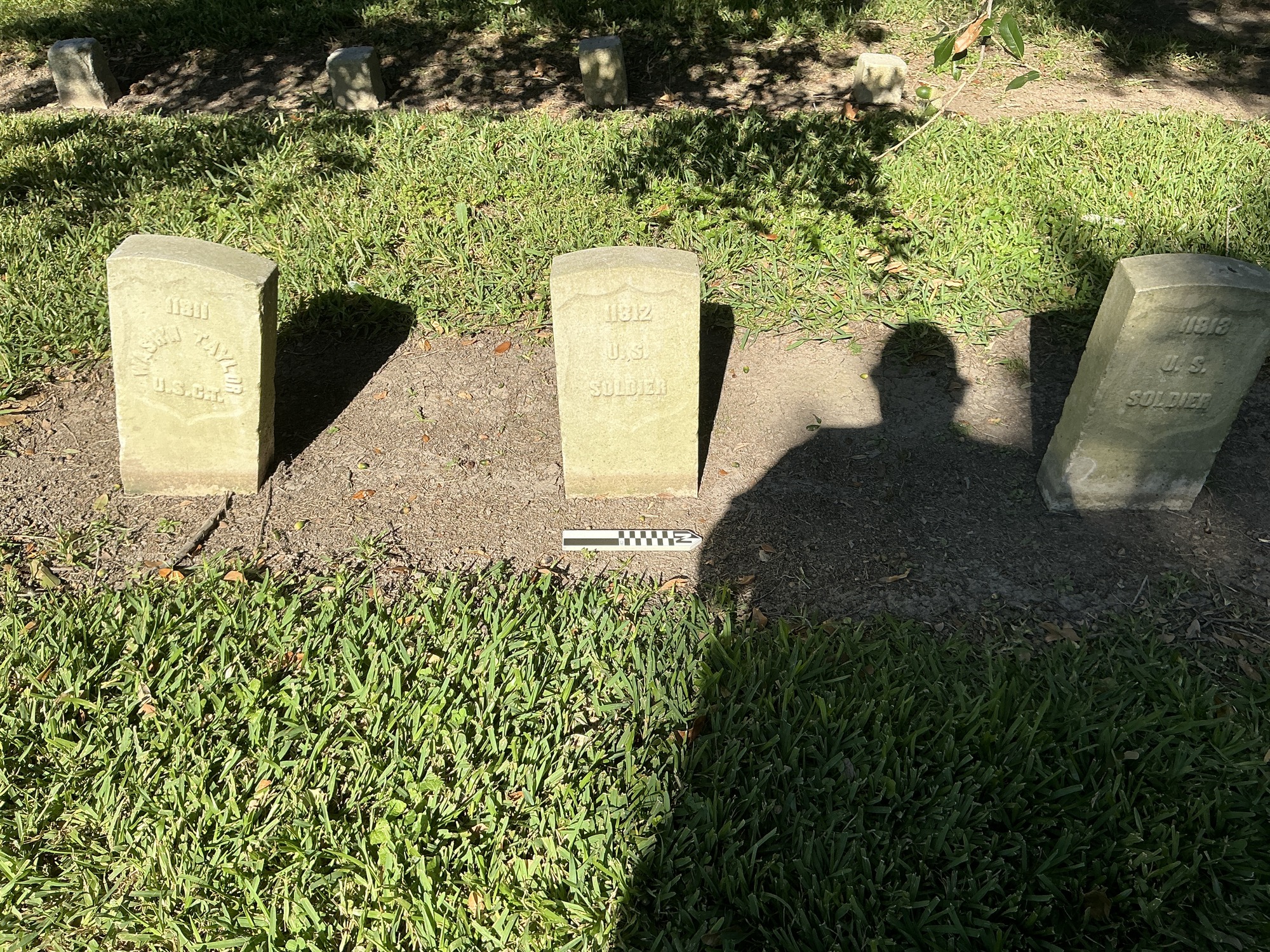Extra image of historic upright marble headstone with recessed shield face.