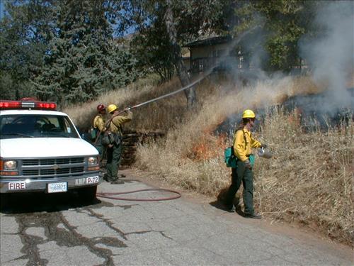 Prescribed burn using drip torch ignition at Ash Mountain Headquarters, Sequoia and Kings Canyon National Parks, May 2004