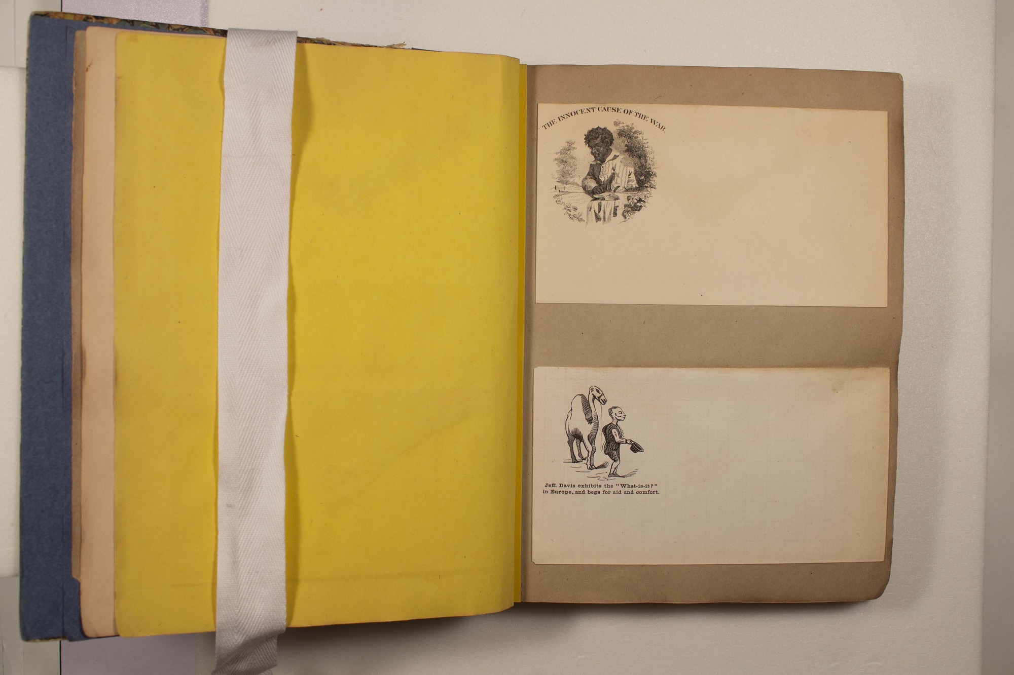 Back of two envelopes which have been glued to page.