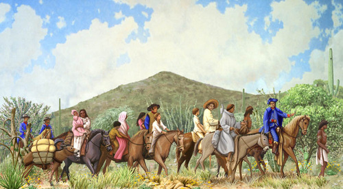 The Anza expedition members travel by horseback through a desert landscape with a large mountain in the distance