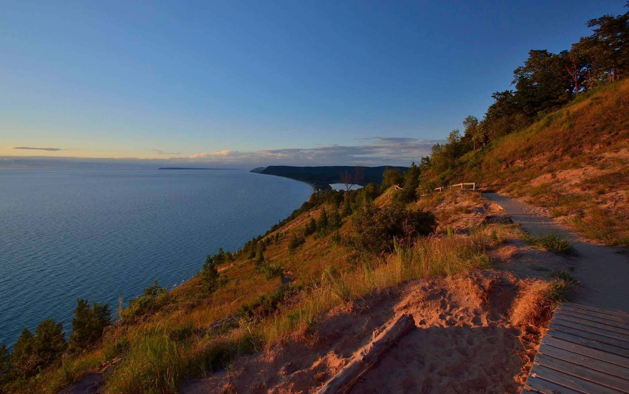 A trail in orange light at sunset
