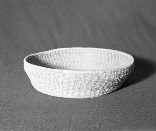 Marie Rozier Collection, Catalog No. 128. Object: Pine needle basket. Dimensions: 15 x 4". Collection History: Acquired from Nellie Ray. Photographed by Michael Dixon, December 1982. Catalogued by Craig Bates and Barbara Beroza. Yosemite Collections, National Park Service.