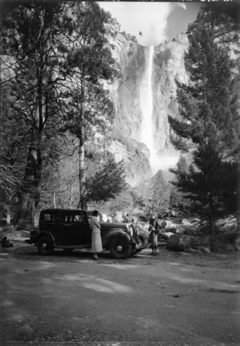 Car and visitors with Bridalveil Fall.