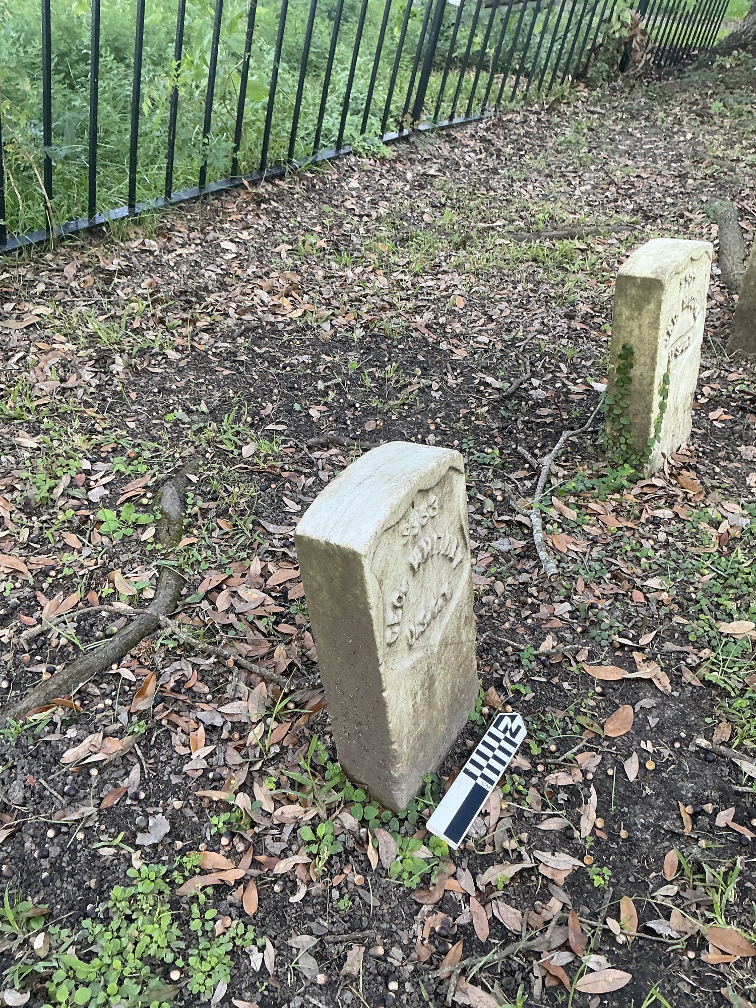 Extra image of historic upright marble headstone with recessed shield face.