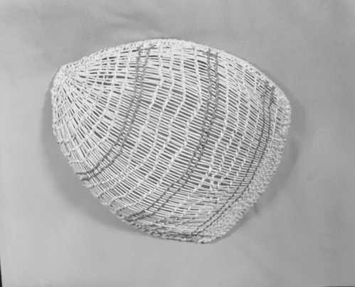 Private Collection. Object: Miwok basket. Dimensions: 15 x 13 x 3". Materials: Ceanothus cuneatus shoots, split and split redbud. Technology: Diagonally twined, up to right slant of turns, splices rather hastily done, overlapping strands sometimes for three inches. One splice rewoven. No alternate slants of turns of twining & one row of three strand twining two inches below selvedge, rimstick attached with the aid of an awl & overlapped at start. Collection History: From Angels Camp. Photographed by Michael Dixon. Catalogued by Craig Bates and Barbara Beroza. Yosemite Collections, National Park Service.