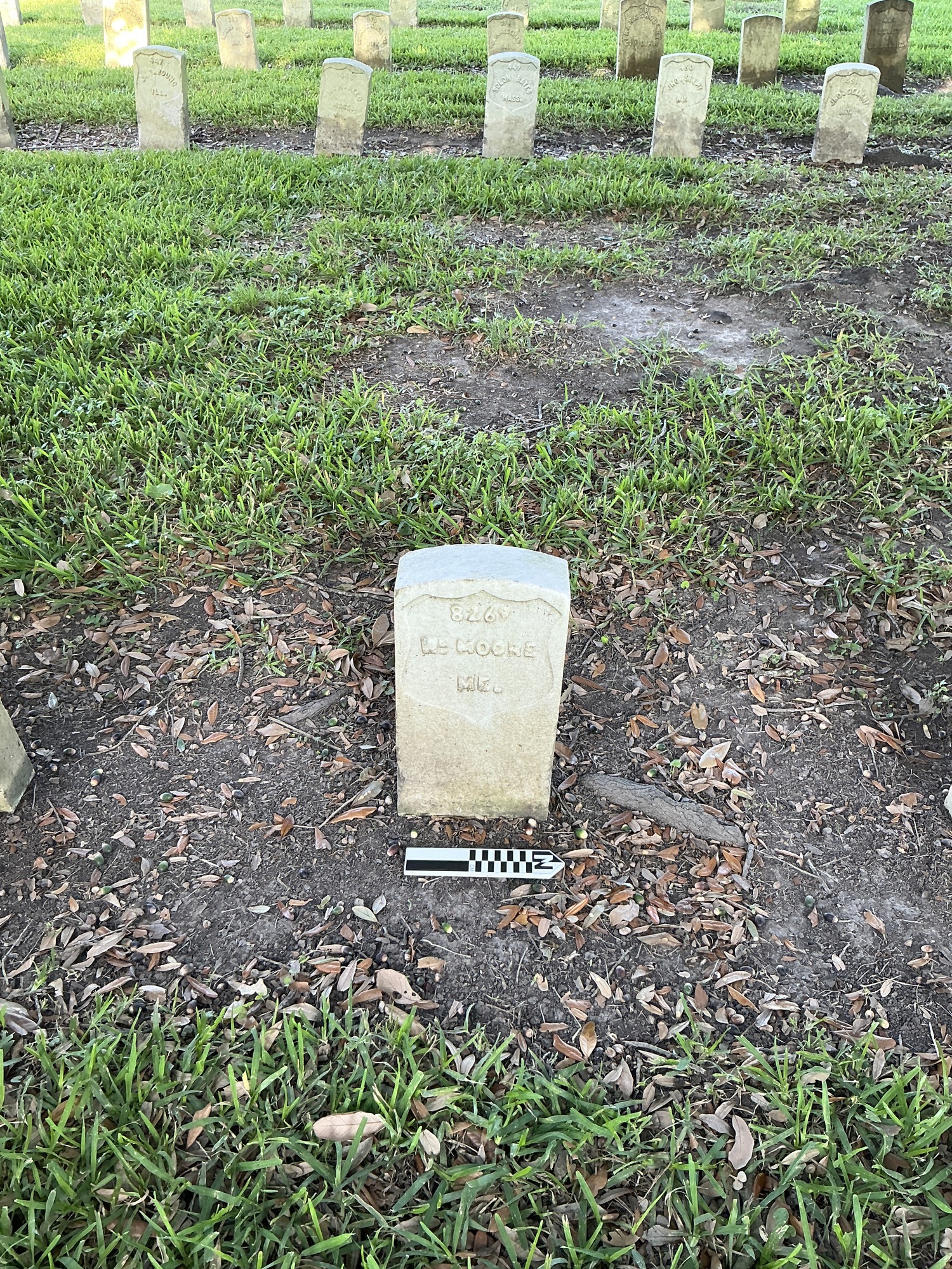Extra image of historic upright marble headstone with recessed shield face.