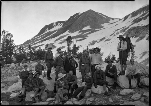 Cropped version of RL-5835. Ranger naturalist Carl Sharsmith with group climbing over Conness Glacier to the top of Mt. Conness.