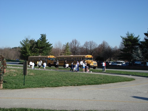 School buses transport runners from the Convention Center.