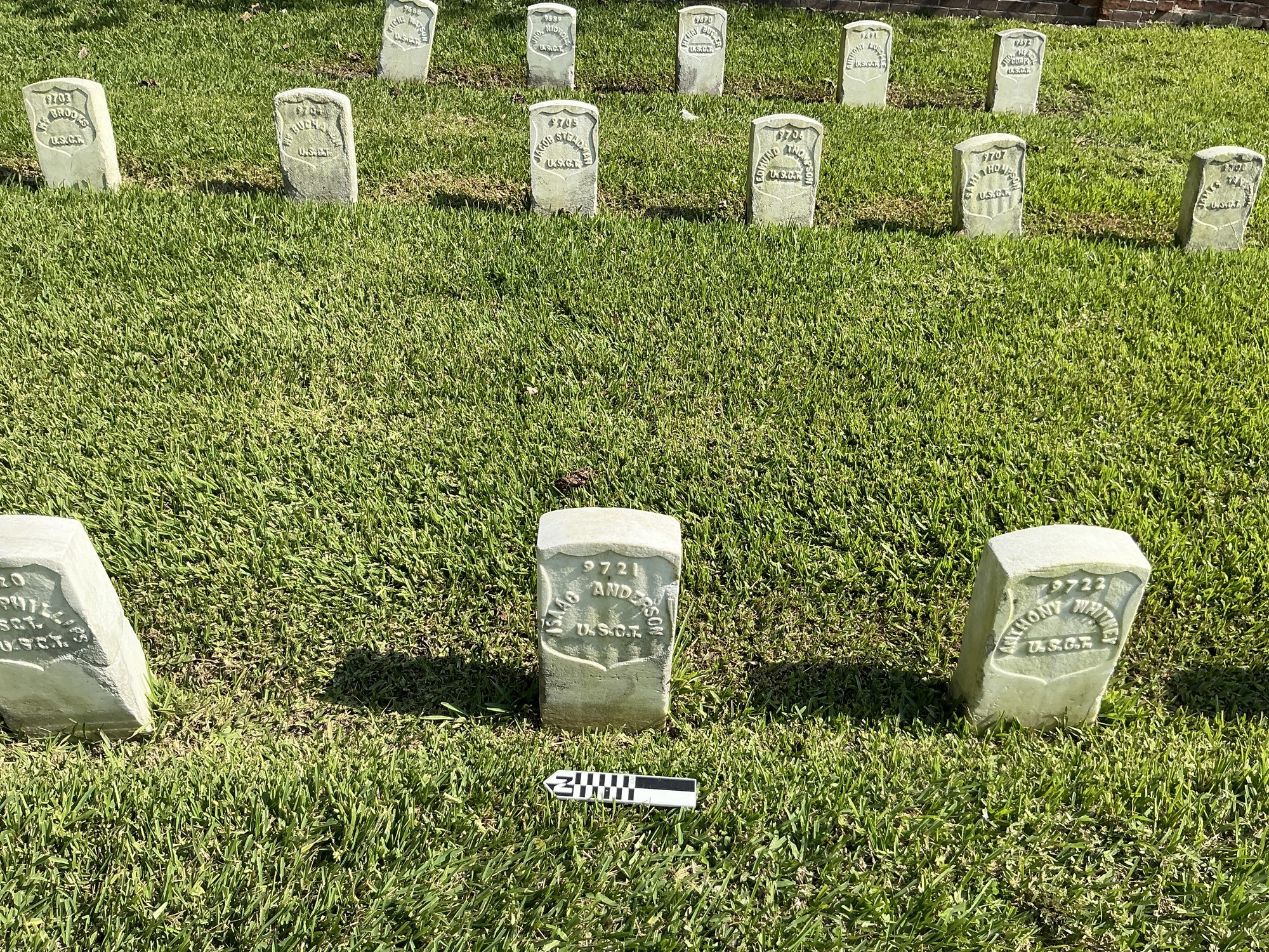 Extra image of historic upright marble headstone with recessed shield face.