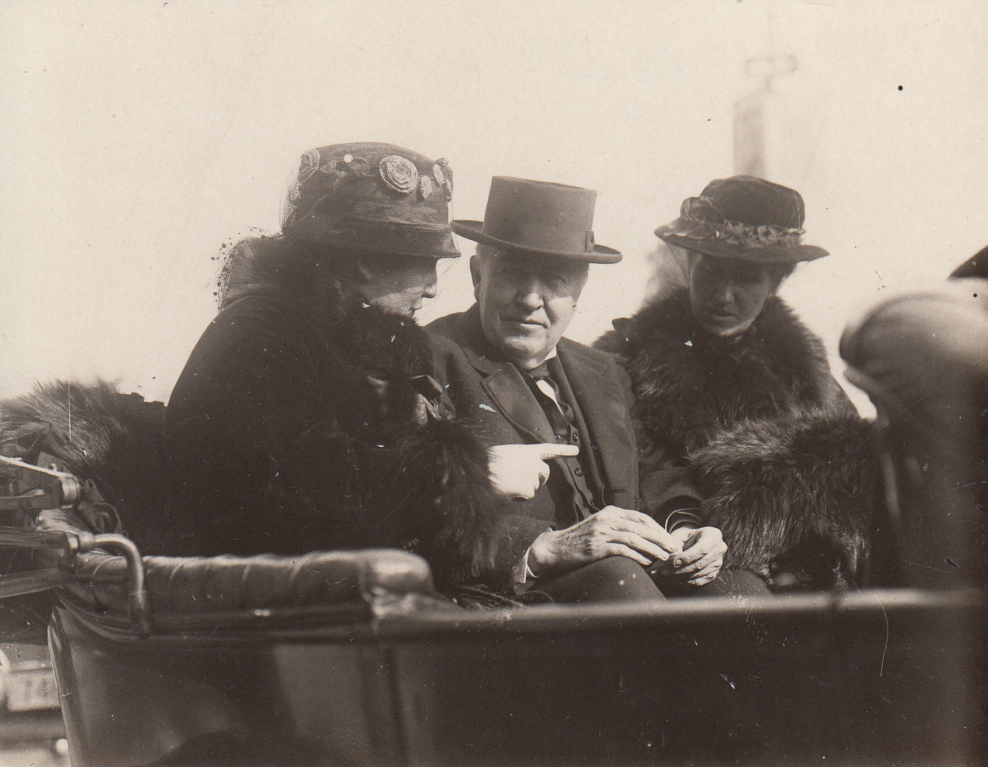 Mina Edison, Thomas Edison, and unidentified woman in automobile.