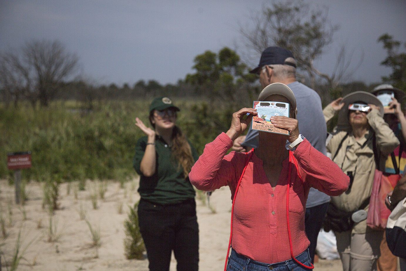 Park visitors looking at the 2017 solar eclipse at the Jamaica Bay Wildlife Refuge