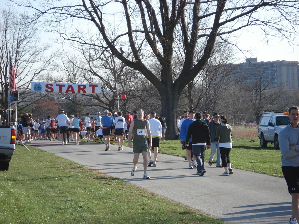 Runners warm up and stetch around the start line prior to the race.