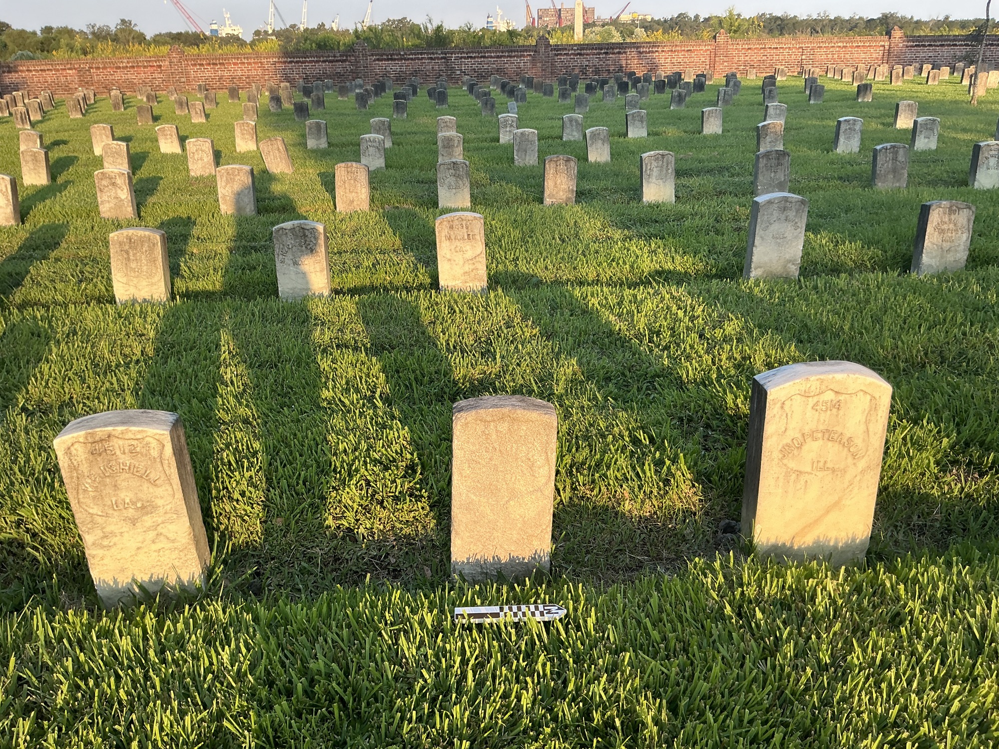 Extra image of historic upright marble headstone with recessed shield face.
