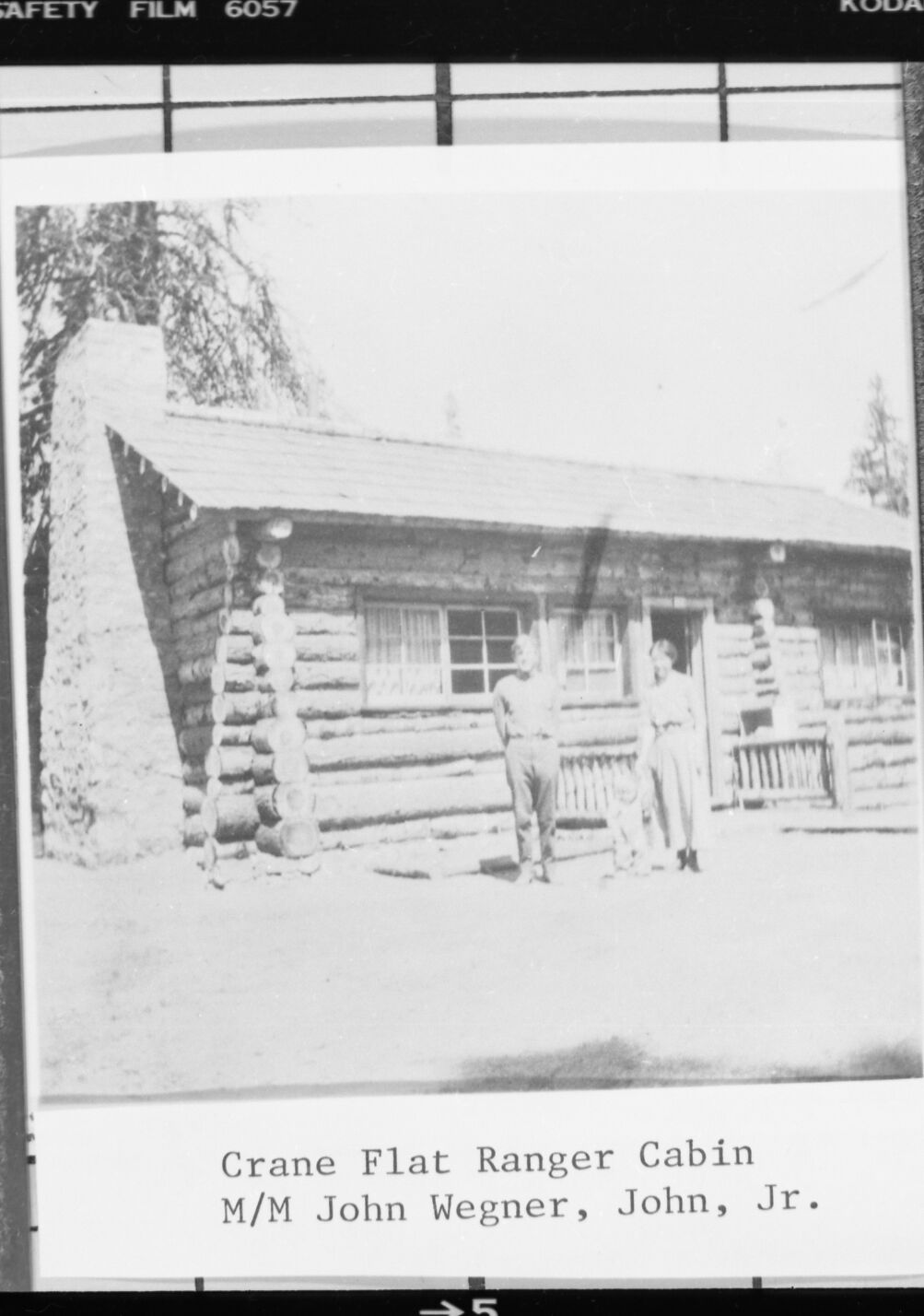 Crane Flat Ranger cabin with Mr. & Mrs. John Wegner & John John, Jr. Copied from the Wegner photo album.