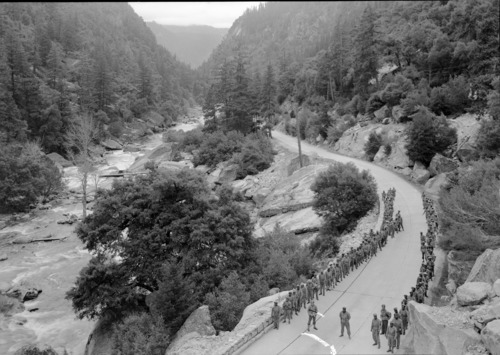 Hiking Soldiers of the 1914th Ordnance Co. on their conditioning march into Yosemite Valley. Merced R. Canyon in the distance.