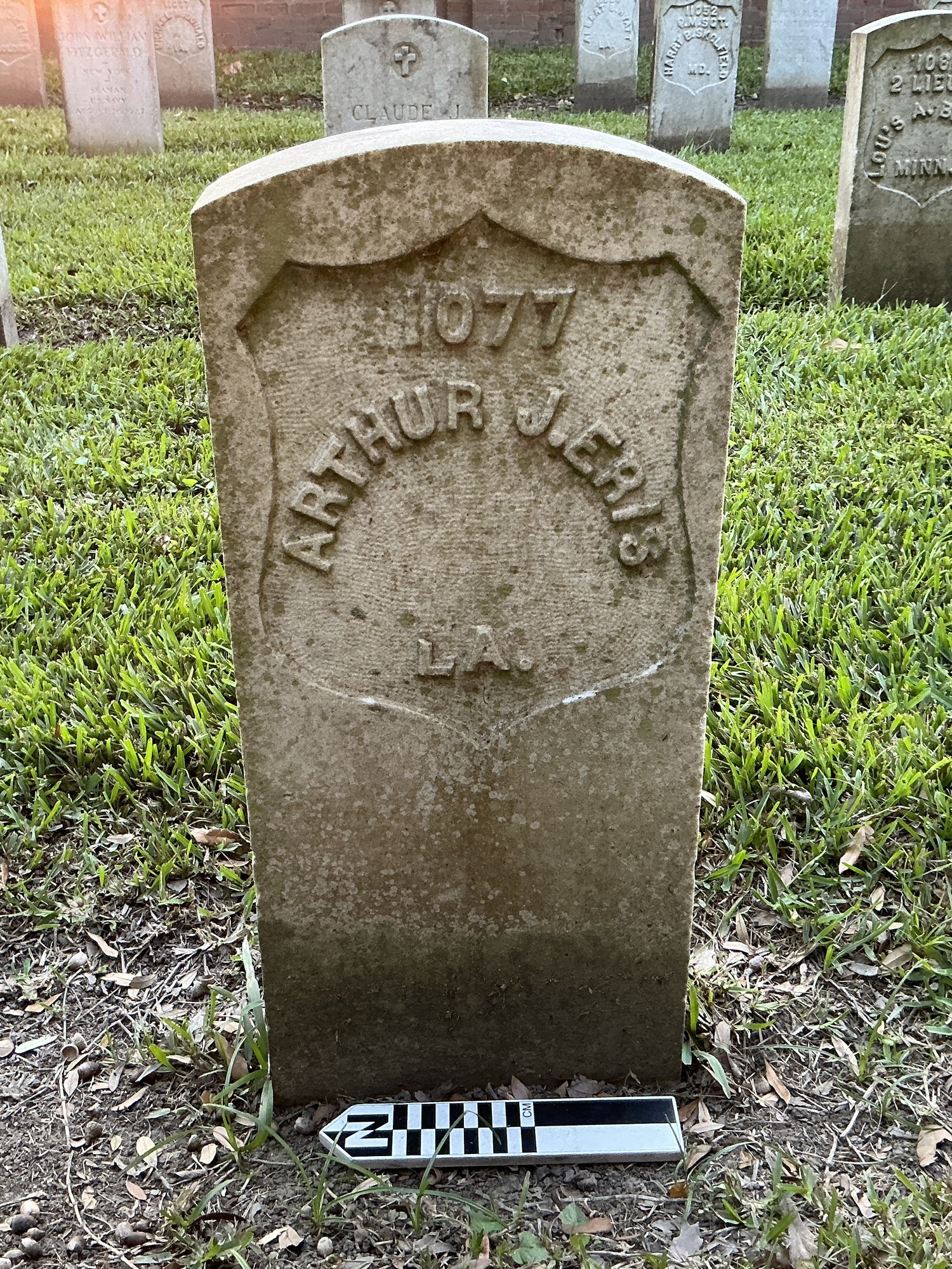 Extra image of historic upright marble headstone with recessed shield face.
