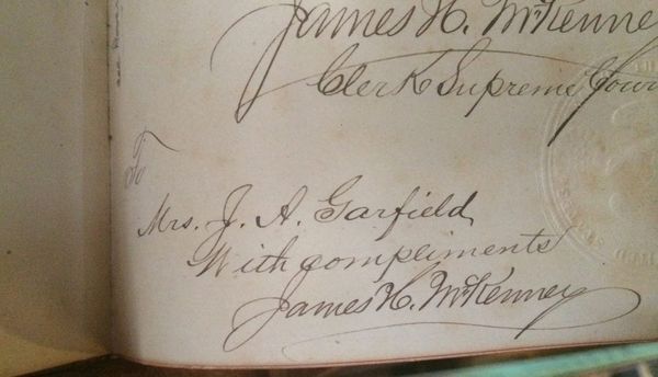 A handwritten inscription to Mrs. Garfield from James H. McKenney- Clerk of the Supreme Court