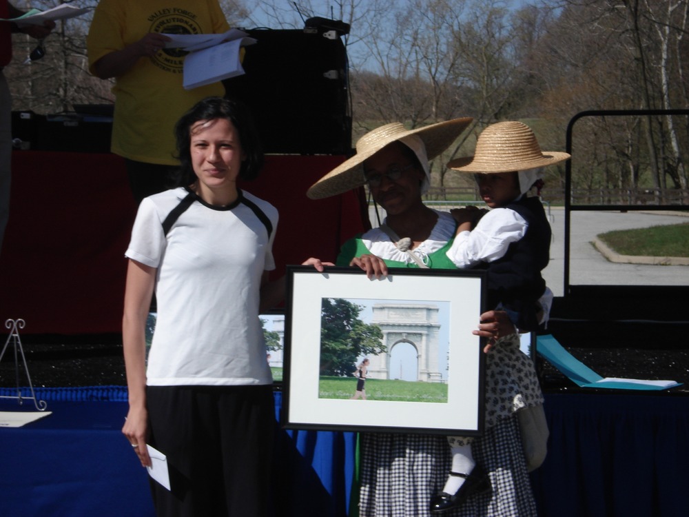 Awards were presented to the top finishers. Park Ranger Ajena Rogers assists with the presentation.