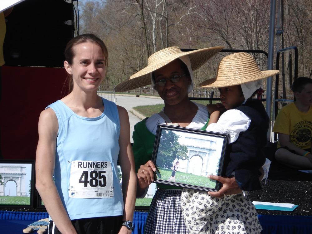 Awards were presented to the top finishers. Park Ranger and Ajena Rogers assists with the presentation.