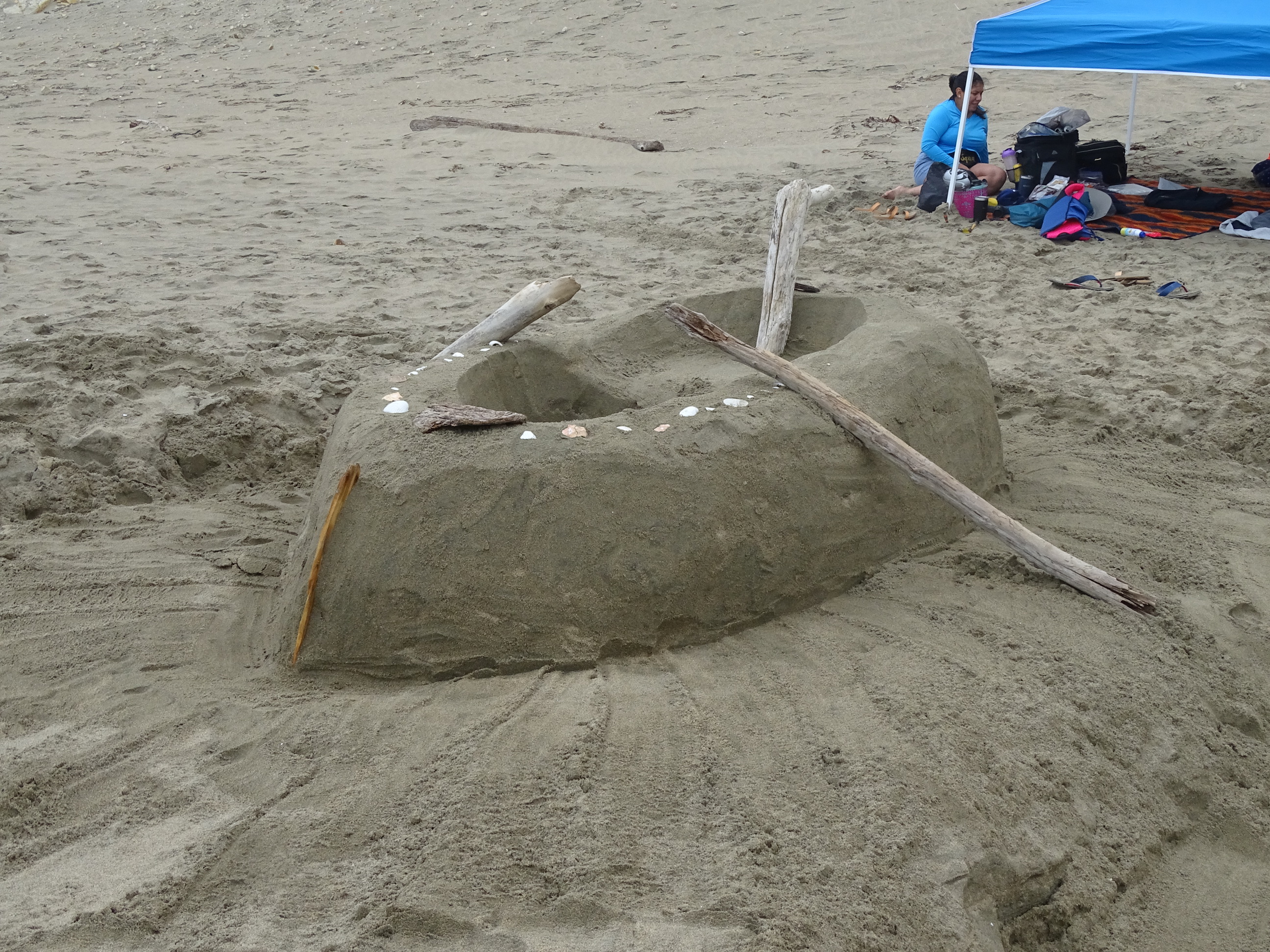 A sand sculpture of a boat.