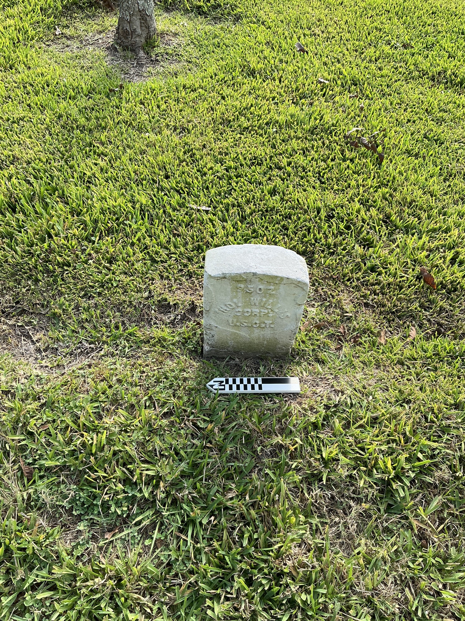 Extra image of historic upright marble headstone with recessed shield face.