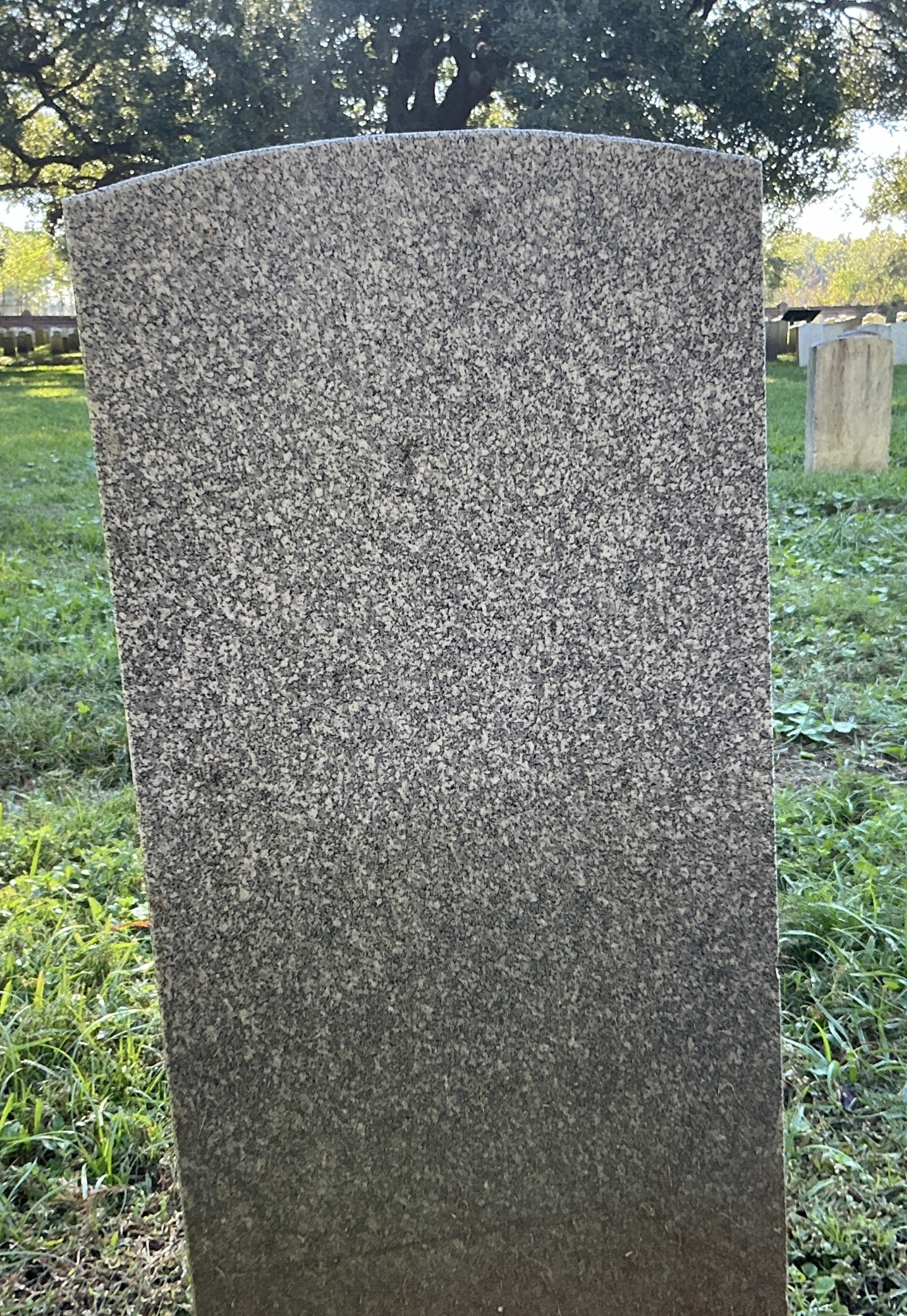 Back of headstone with flat face.