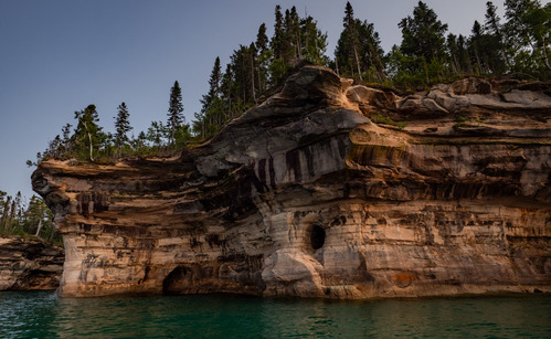 
Mineral-stained cliffs rise out of Lake Superior
