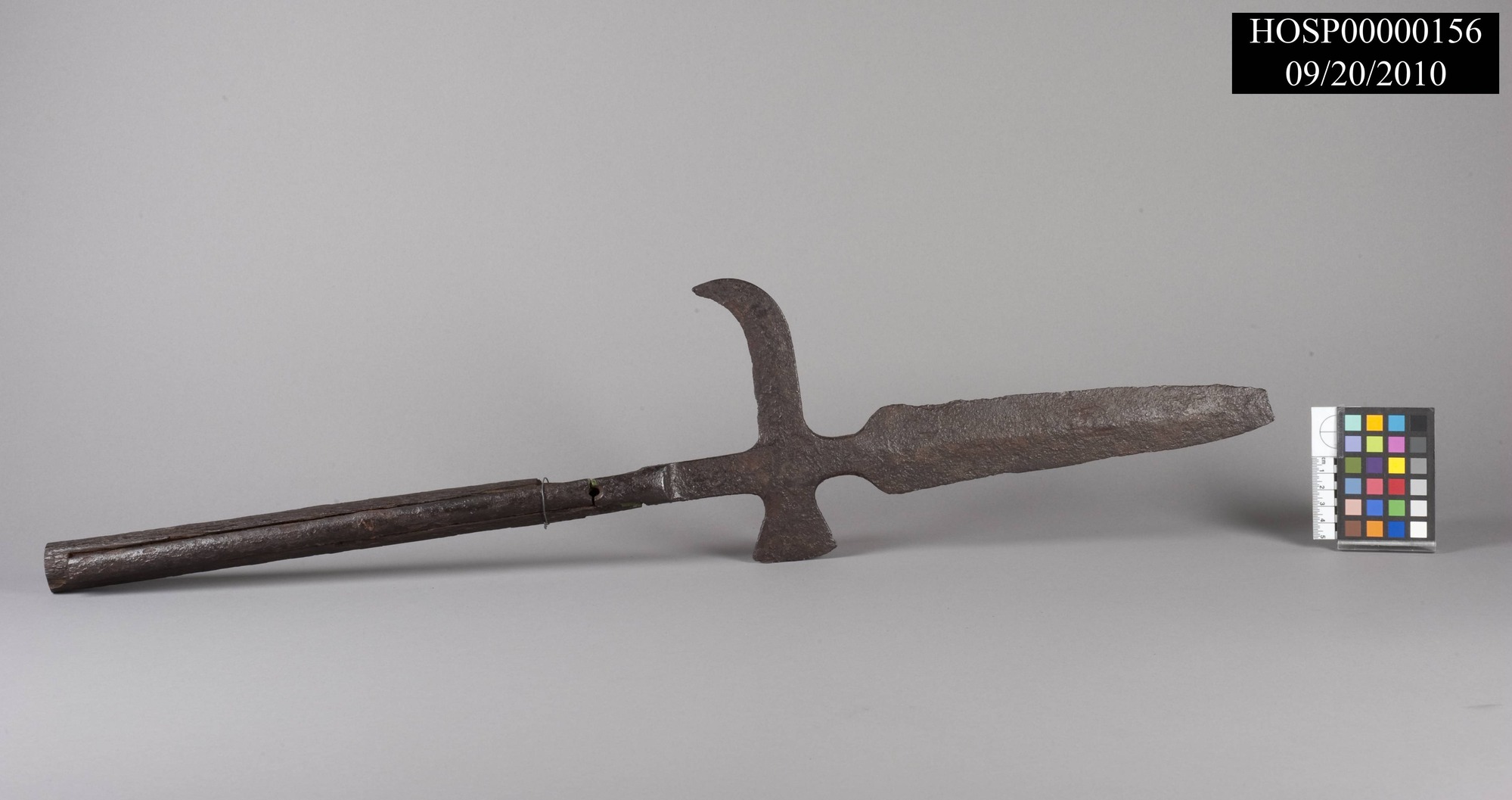 Halberd, Spanish, supposed artifact of DeSoto expedition through Arkansas; iron head, wooden handle banded in iron; head has spear-like point on end (with broken tip), small ax blade on one side, curved hook on opposite side; accompanied by image of John Fordyce drawing of original, sent to HOSP by Dr. Anne Early, Arkansas State Archeologist, in October 2011 (original drawing in archives at University of Arkansas - Fayetteville). Curator's Notes from 8/7/2014 and 10/15/2014: Halberd has been examined by Dr. Jeffrey Michem of AAS and determined likely to be an actual weapon from the DeSoto expedition and Spanish in origin.
