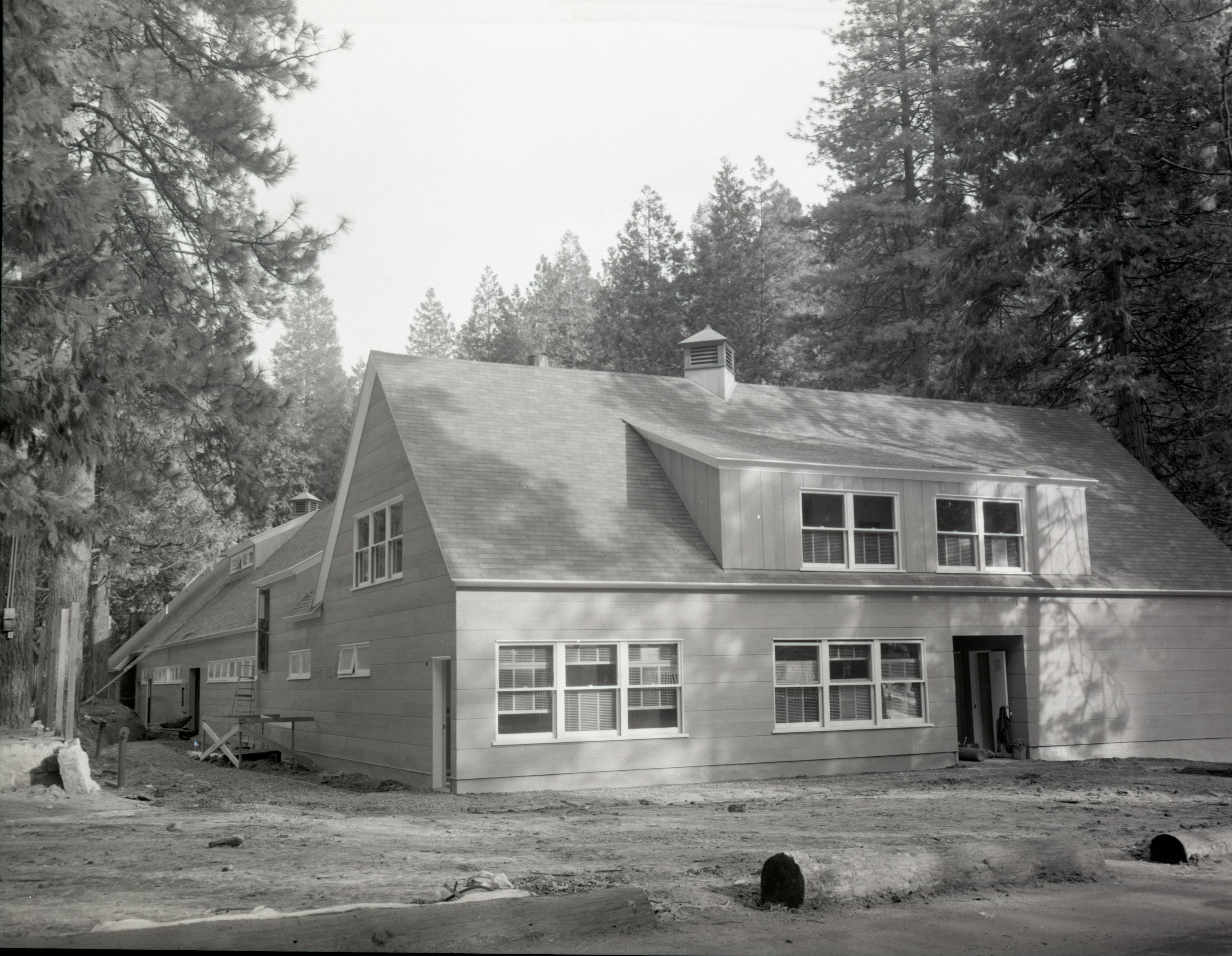 Construction of the New Yosemite Lodge 1955-1956. 7 negatives of December 13, 1955 including Cedar Cottage.