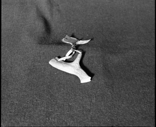 Marie Rozier Collection. Object: Caribou antler keychain. Dimensions: 4 1/2". Materials: caribou antler, commercially-tanned leather. Collection History: Acquired in Northwest Canada. Photographed by Michael Dixon, December 1982. Catalogued by Craig Bates and Barbara Beroza. Yosemite Collections, National Park Service.