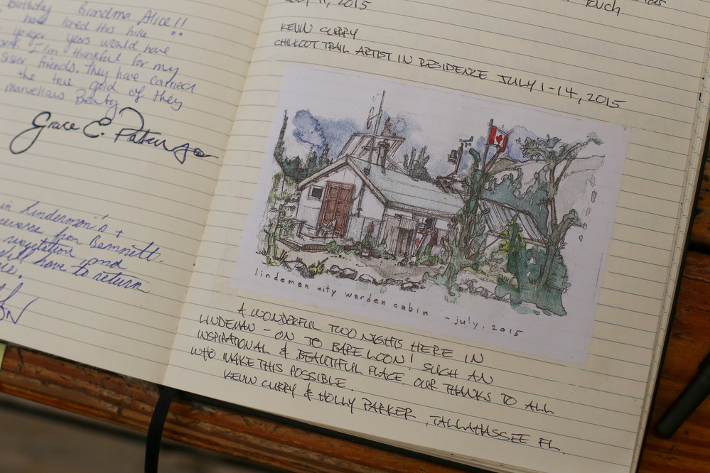 Close up of book with painting and writing