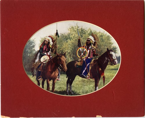  two Native Americans on horseback; mounted with oval view mat (red in color)