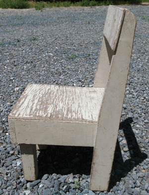A child's handmade wooden chair.