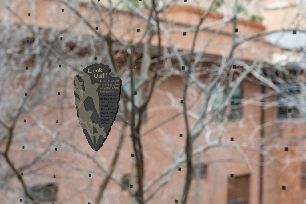 Close up image of an NPS logo with text describing what the purpose of the stickers on the windows are