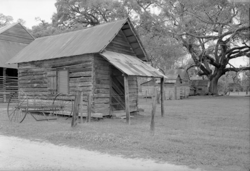 Black and white photo of un-whitewashed carpenter shop
