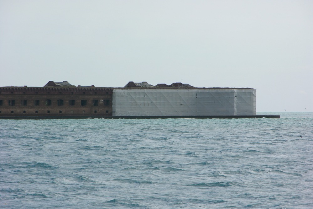 Fort Wall with tarp to prevent materials falling into mote that surrounds the Fort.