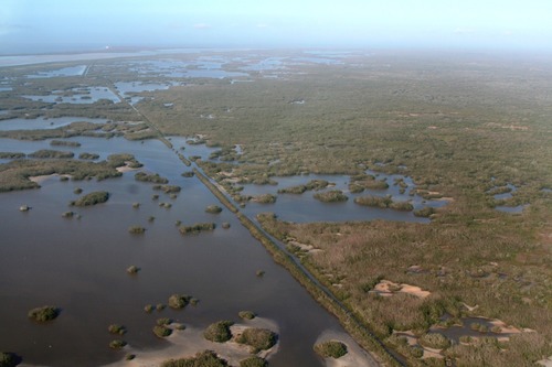 The Homestead Canal is distictly visible in this aerial photoraph, joining Lake Ingraham far in the distance.