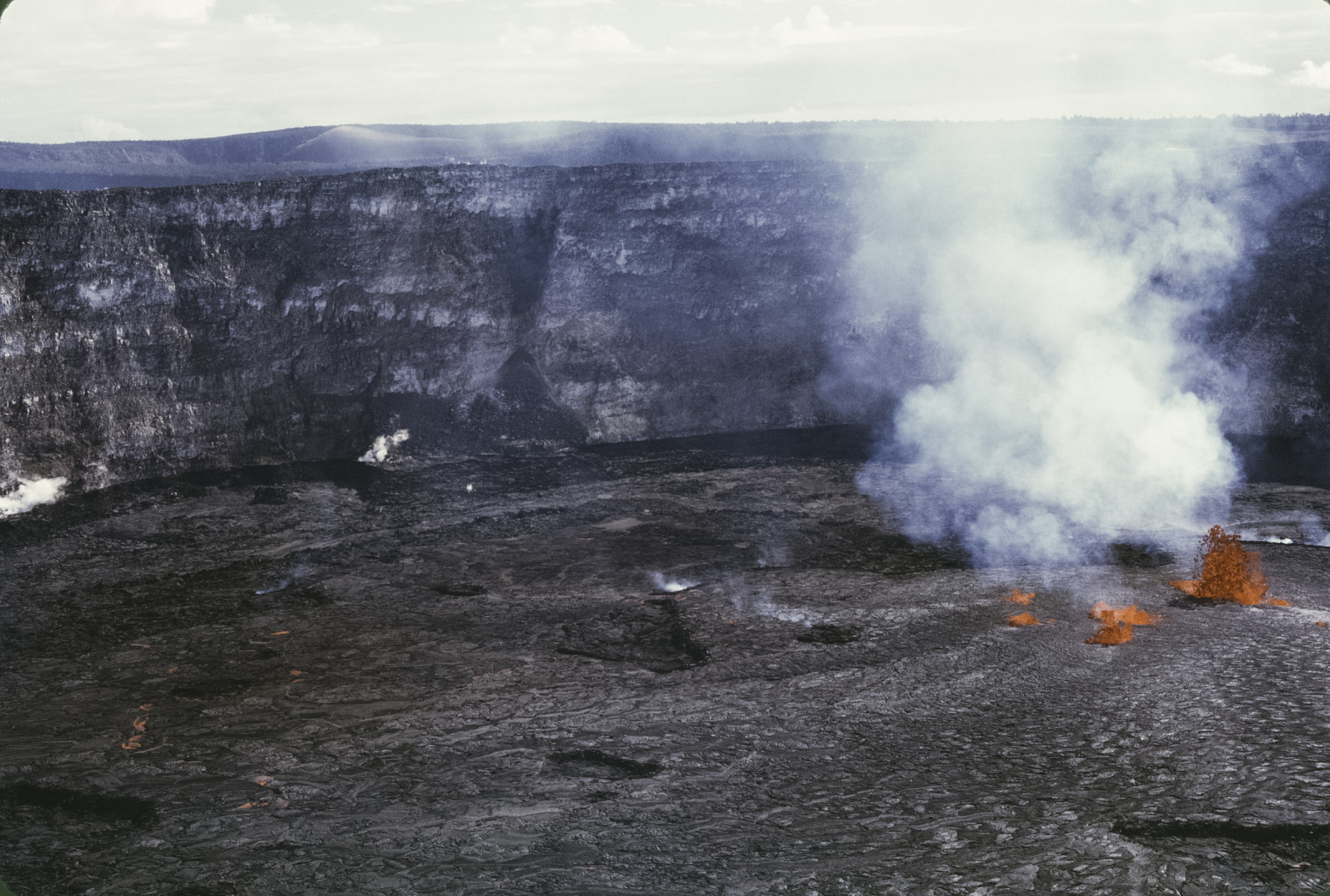 Erupting lava fountains in a volcanic crater
