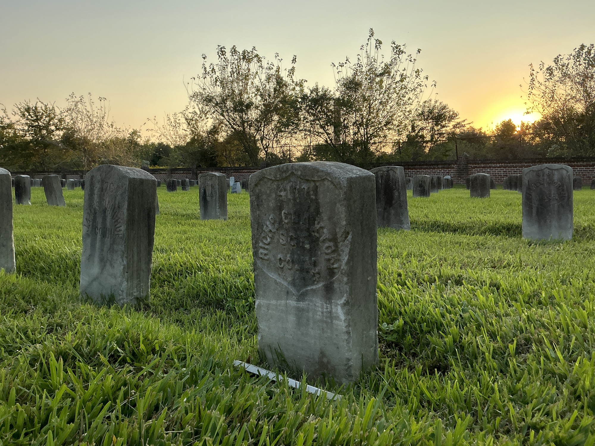Extra image of historic upright marble headstone with recessed shield face.