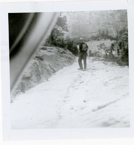 Man walking along the East Rim trail.