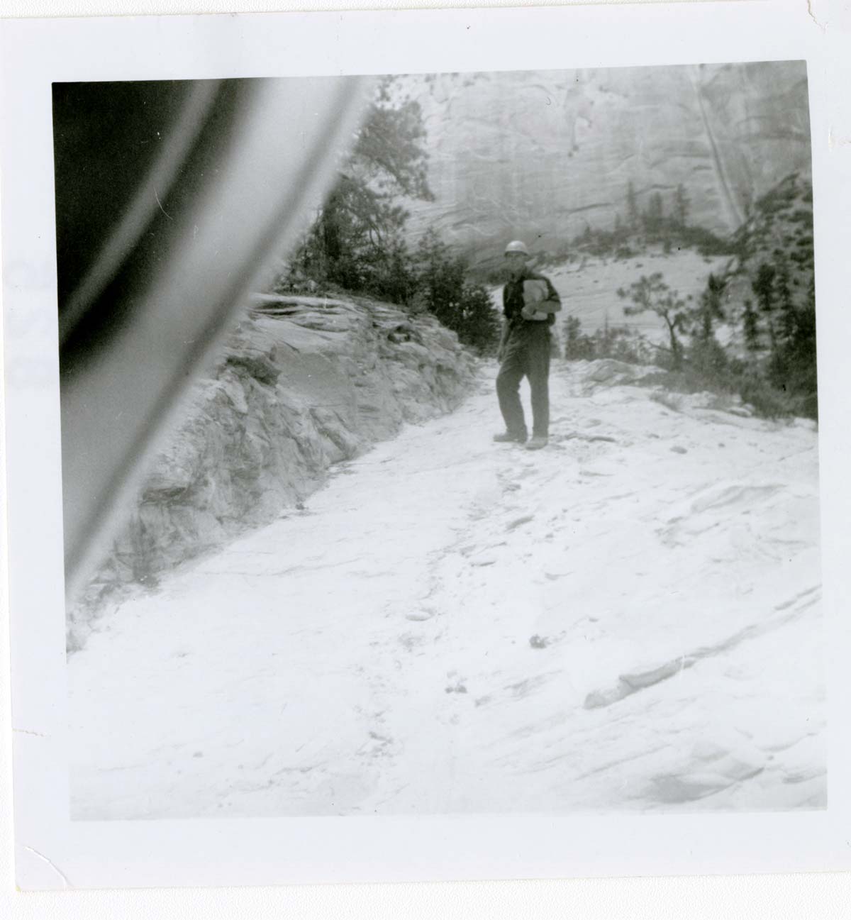 Man walking along the East Rim trail.